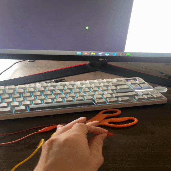 Exploring the scissors as a two-handed input, one hand on each blade, to see if the human body acting as a bridge between the two clips completes the circuit.